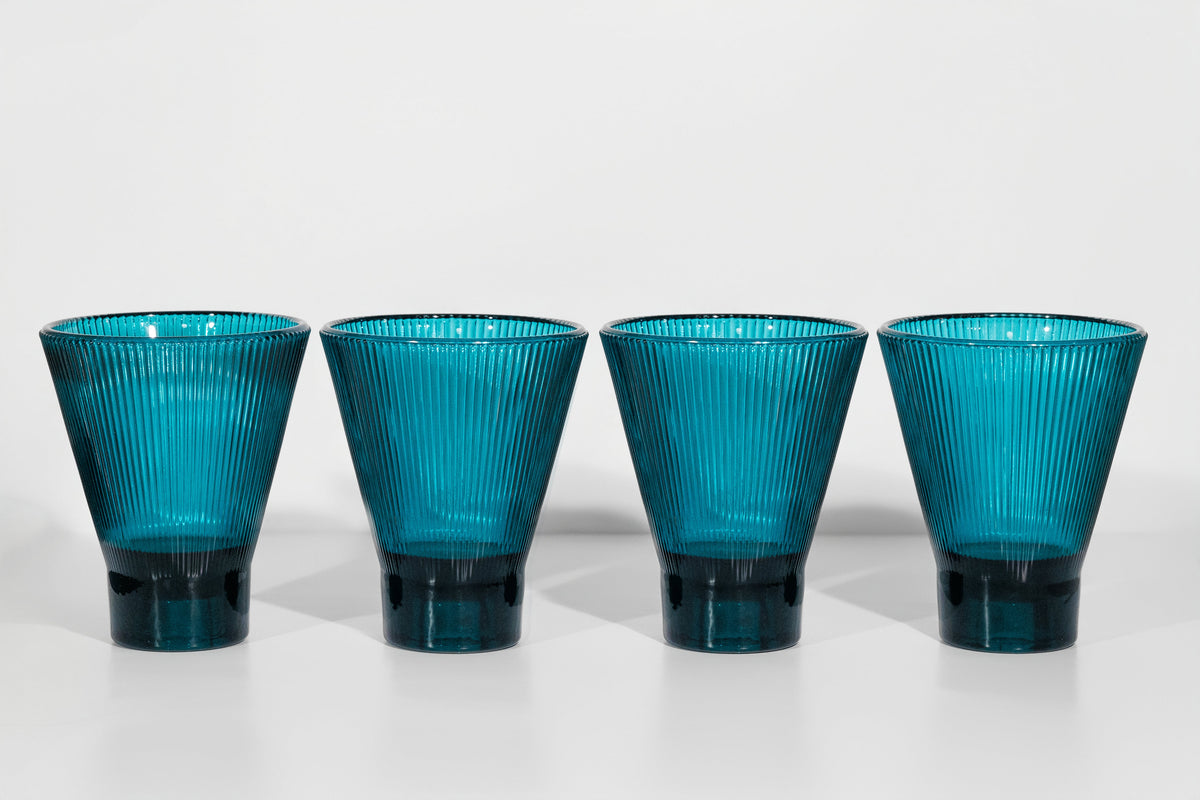 four teal zai tumblers