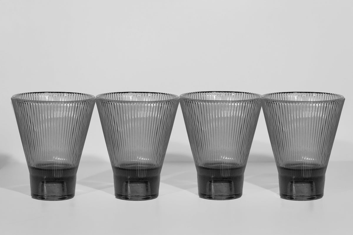 Four black ZAI tumblers