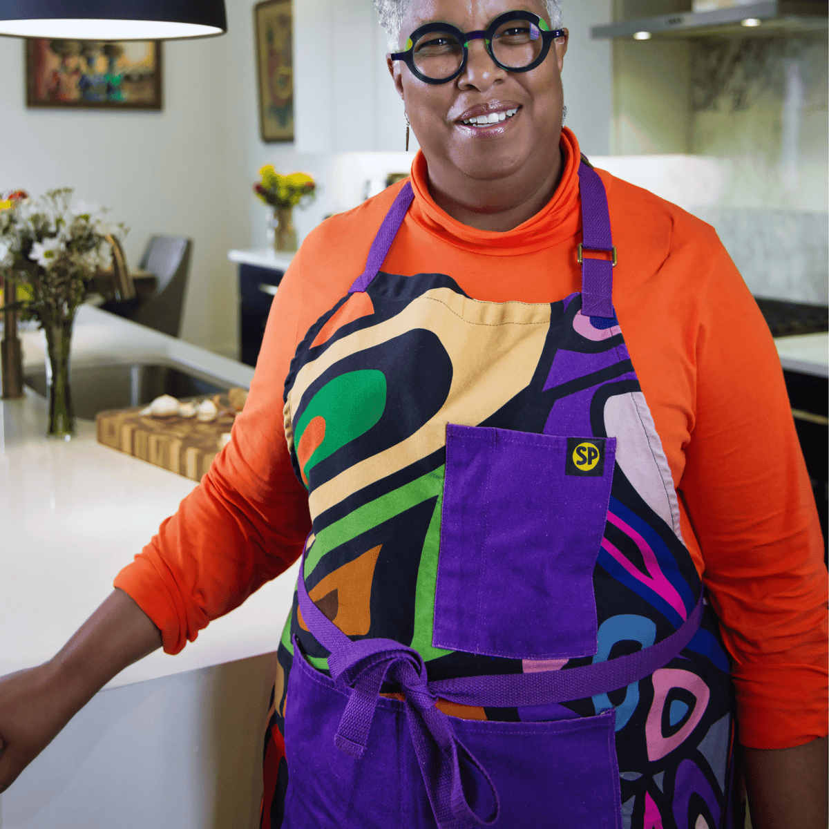 Aravella apron worn in a kitchen