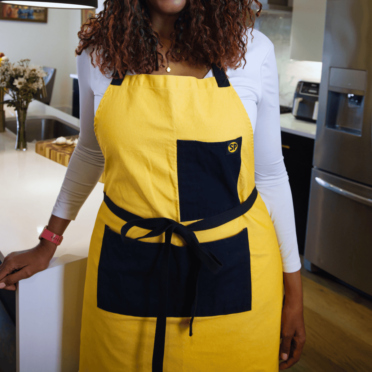 cornbread gold apron worn in a kitchen
