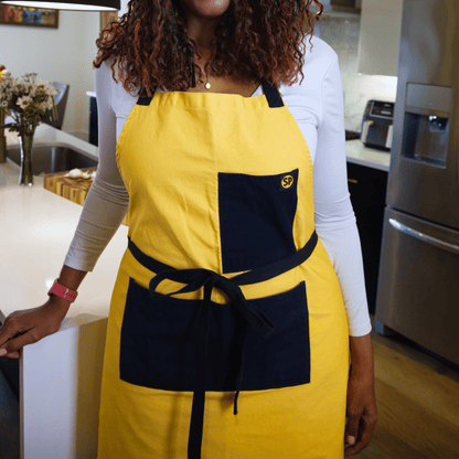 Cornbread Gold apron worn in a kitchen