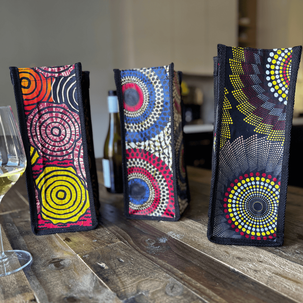 Three examples of soulPhoodie upcycled wine bags with different patterns